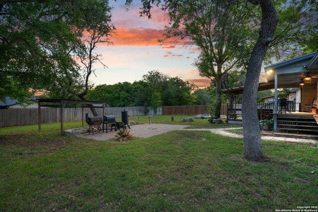 104 Holly Hl, Ingram, TX 78025 - yard at dusk with a deck, a patio area, and a pergola