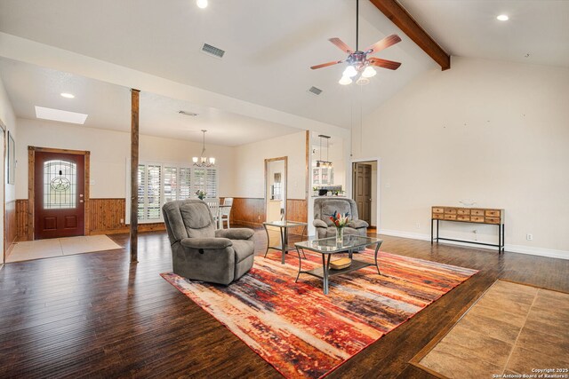 104 Holly Hl, Ingram, TX 78025 - living area with hardwood / wood-style floors, beamed ceiling, wainscoting, a ceiling fan, and a chandelier