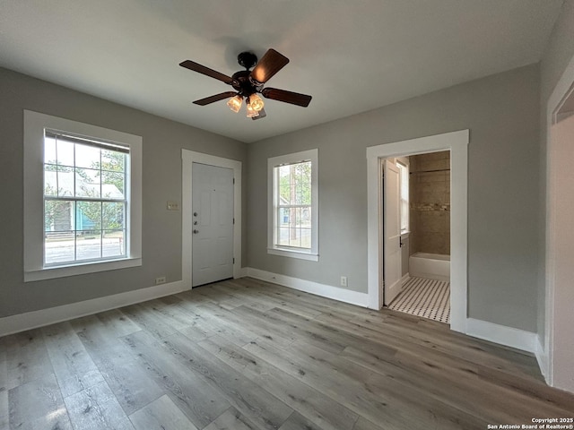 270 Oelkers, San Antonio, TX 78204 - foyer entrance with healthy amount of natural light, baseboards, wood finished floors, and a ceiling fan