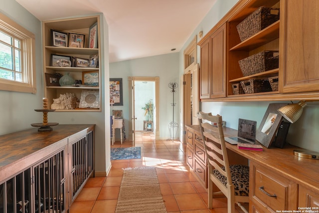 529 N High, Uvalde, TX 78801 - office area featuring built in study area and light tile patterned floors