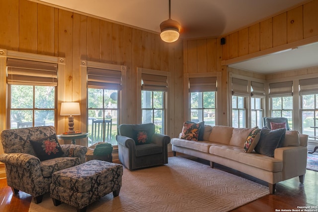 529 N High, Uvalde, TX 78801 - living area featuring wood finished floors and wooden walls