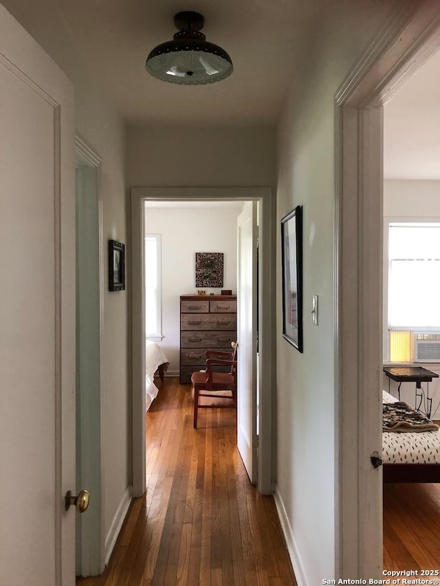 345 Westminster, San Antonio, TX 78228 - corridor featuring dark wood-style flooring and baseboards