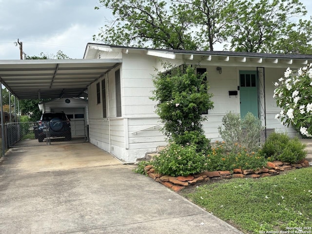 345 Westminster, San Antonio, TX 78228 - view of front of property featuring concrete driveway, fence, and an attached carport