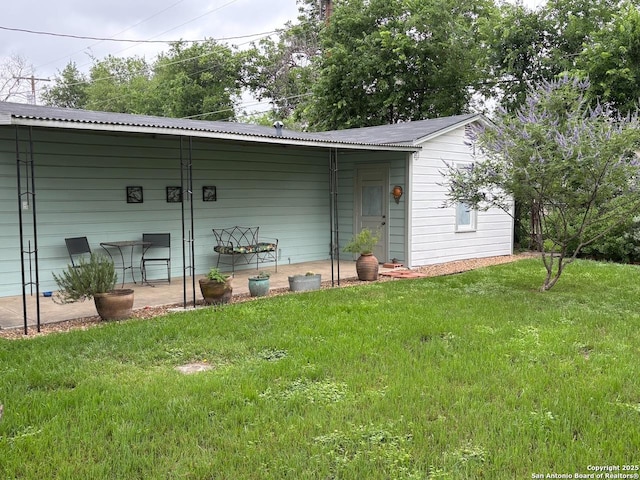 345 Westminster, San Antonio, TX 78228 - rear view of property featuring a yard and metal roof
