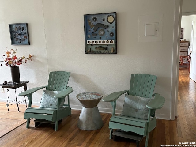 345 Westminster, San Antonio, TX 78228 - sitting room with wood finished floors, baseboards, and electric panel