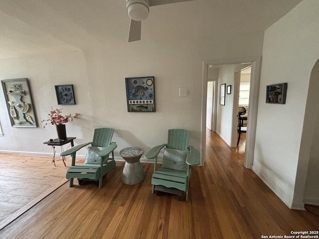 345 Westminster, San Antonio, TX 78228 - sitting room with wood finished floors, ceiling fan, baseboards, and arched walkways