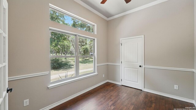7881 Wegner, New Braunfels, TX 78132 - empty room featuring healthy amount of natural light, ceiling fan, crown molding, baseboards, and dark wood finished floors