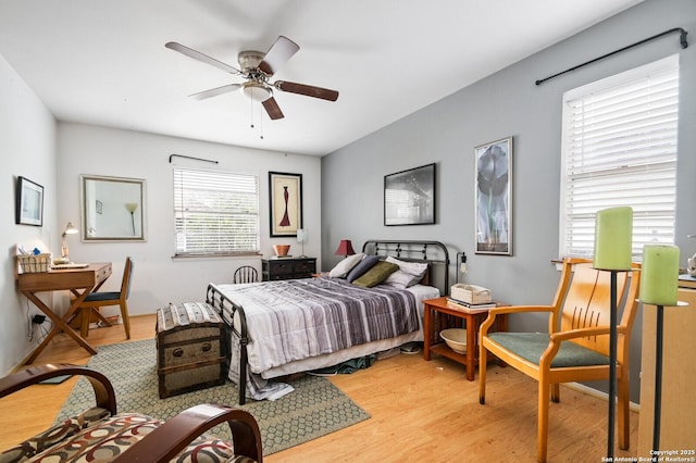 2811 Woodbury Unit 106, San Antonio, TX 78217 - bedroom with light wood finished floors and ceiling fan