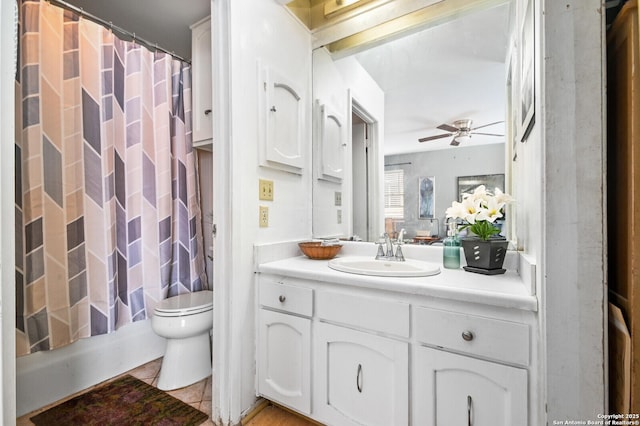2811 Woodbury Unit 106, San Antonio, TX 78217 - full bathroom featuring toilet, vanity, a ceiling fan, tile patterned floors, and shower / bathtub combination with curtain