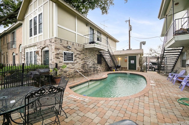 2811 Woodbury Unit 106, San Antonio, TX 78217 - community pool with stairs, fence, and a patio