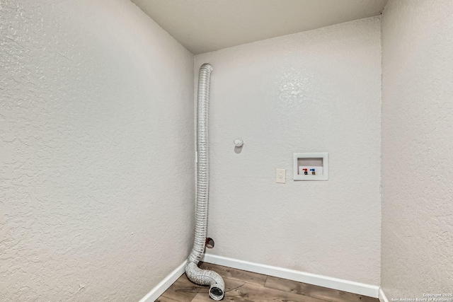 1022 Vickers Ave, San Antonio, TX 78211 - laundry area featuring wood finished floors, baseboards, and hookup for a washing machine