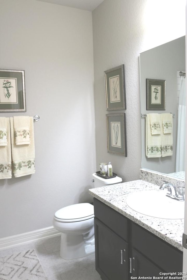 1854 Worsham Pass, San Antonio, TX 78260 - full bath featuring vanity, toilet, tile patterned flooring, and baseboards