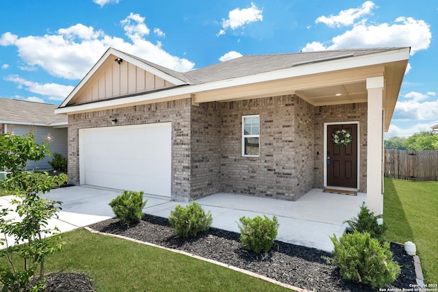 7910 Asp Pt, San Antonio, TX 78253 - ranch-style home featuring a garage, brick siding, board and batten siding, and driveway