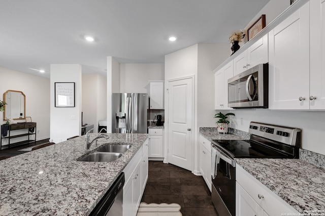 7910 Asp Pt, San Antonio, TX 78253 - kitchen with appliances with stainless steel finishes, a sink, white cabinets, light stone counters, and recessed lighting