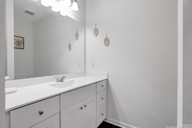 7910 Asp Pt, San Antonio, TX 78253 - bathroom with vanity, baseboards, and a textured wall
