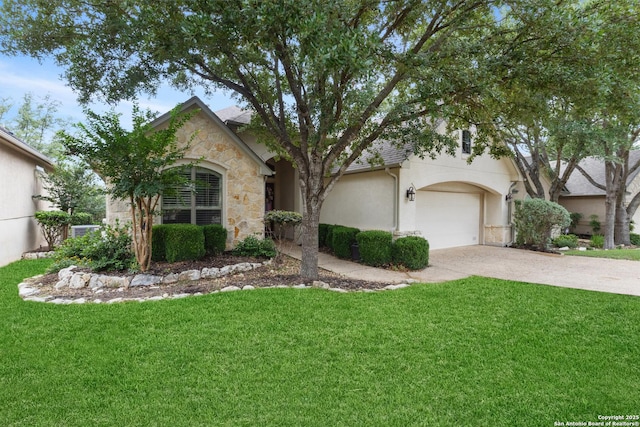 143 Roseheart, San Antonio, TX 78259 - view of front facade with a front yard, driveway, stucco siding, and stone siding