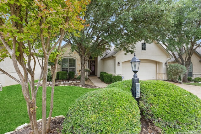 143 Roseheart, San Antonio, TX 78259 - view of front facade featuring concrete driveway, stucco siding, a garage, and a front yard