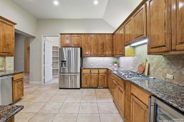 143 Roseheart, San Antonio, TX 78259 - kitchen featuring stainless steel appliances, wine cooler, brown cabinets, tasteful backsplash, and recessed lighting