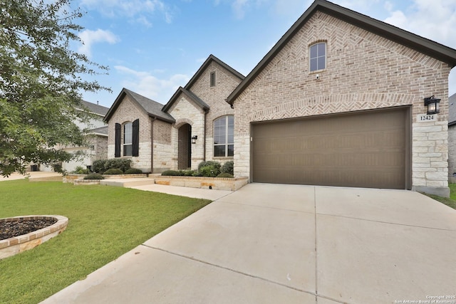 12424 Upton Park, San Antonio, TX 78253 - french country style house featuring concrete driveway, a front yard, brick siding, and stone siding