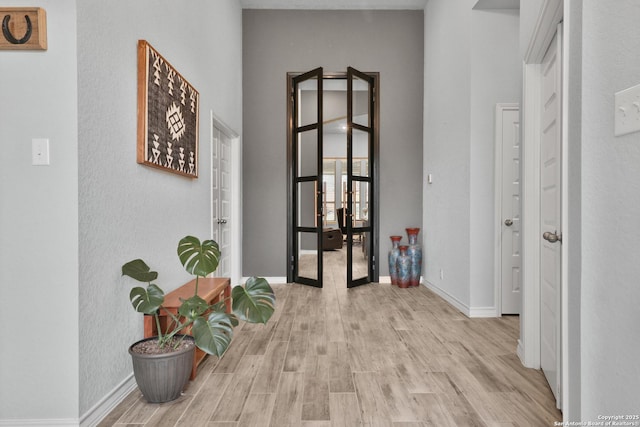 12424 Upton Park, San Antonio, TX 78253 - hall featuring wood finished floors, french doors, baseboards, and a towering ceiling