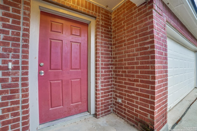 11023 Gilpin, Helotes, TX 78023 - view of exterior entry featuring brick siding and a garage