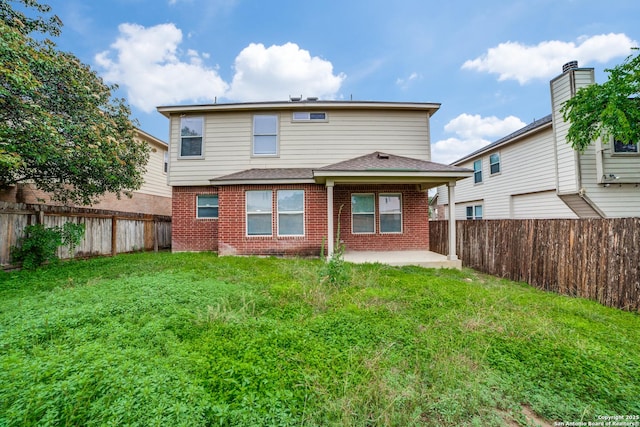11023 Gilpin, Helotes, TX 78023 - rear view of house with brick siding, a patio area, and roof with shingles