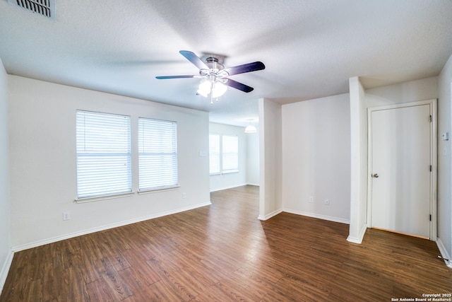 11023 Gilpin, Helotes, TX 78023 - empty room featuring a ceiling fan, wood finished floors, and baseboards