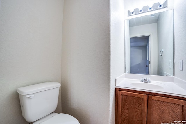 11023 Gilpin, Helotes, TX 78023 - bathroom featuring vanity and toilet