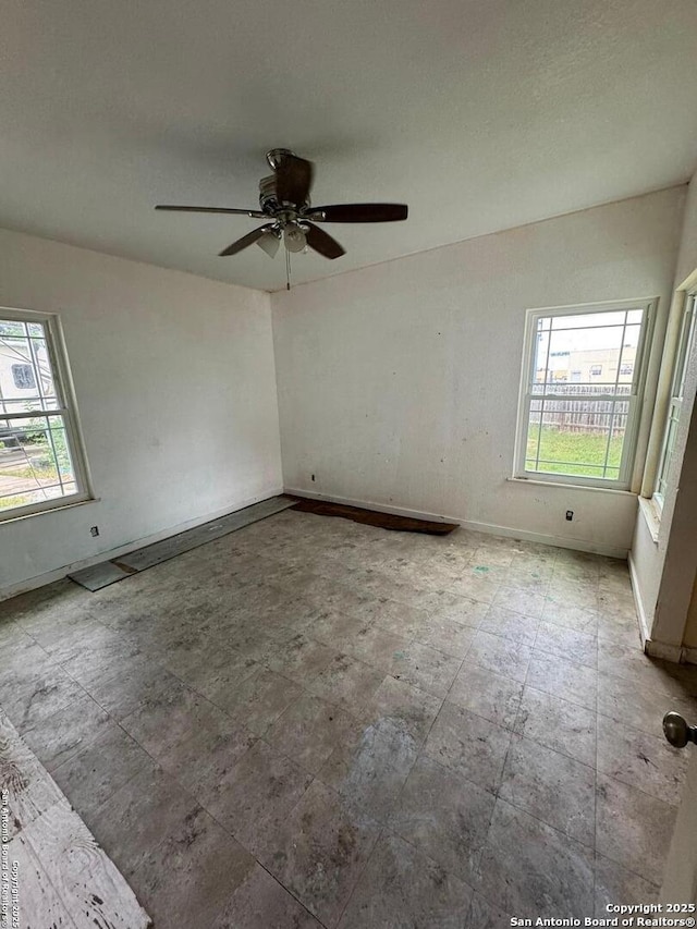 1702 Westmar, San Antonio, TX 78227 - empty room featuring baseboards and ceiling fan