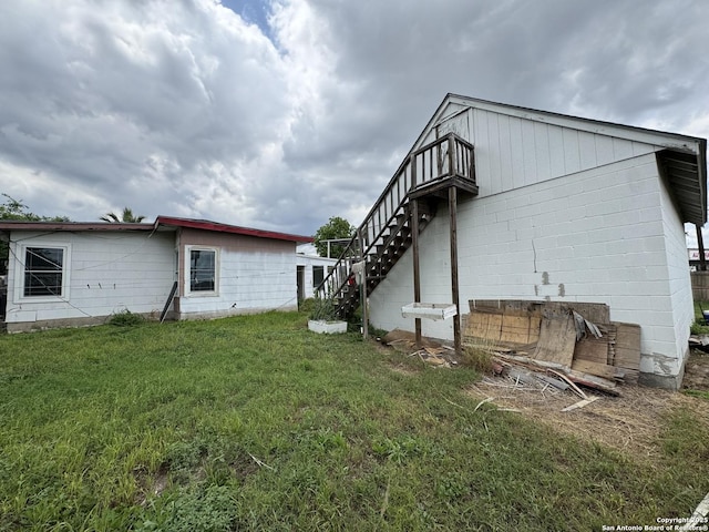 1702 Westmar, San Antonio, TX 78227 - rear view of property with stairs and a lawn
