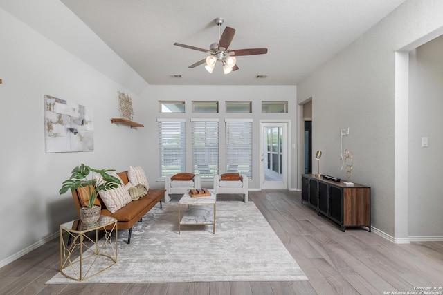 14703 Running Wolf, San Antonio, TX 78245 - living room featuring a ceiling fan, light wood-type flooring, and baseboards