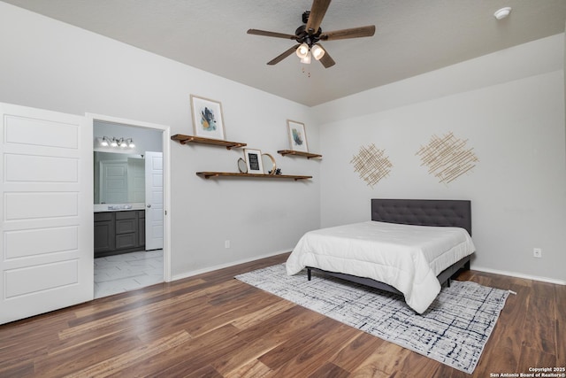 14703 Running Wolf, San Antonio, TX 78245 - bedroom featuring baseboards, wood finished floors, connected bathroom, and a ceiling fan