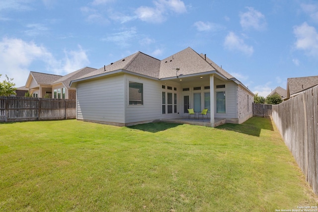 14703 Running Wolf, San Antonio, TX 78245 - rear view of property featuring a shingled roof and a patio