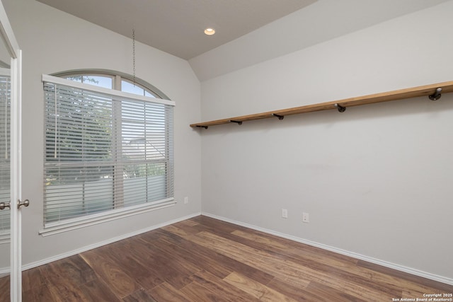 14703 Running Wolf, San Antonio, TX 78245 - unfurnished dining area featuring lofted ceiling, wood finished floors, baseboards, and recessed lighting