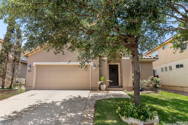 18010 Camino Del Mar, San Antonio, TX 78257 - view of front facade featuring stucco siding, a garage, concrete driveway, and a front lawn