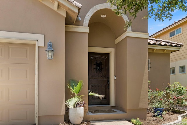 18010 Camino Del Mar, San Antonio, TX 78257 - property entrance featuring a garage and stucco siding