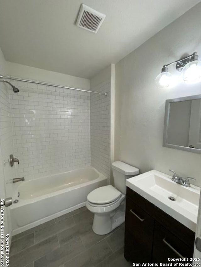 438 Vanderbilt, San Antonio, TX 78210 - full bathroom with toilet, tub / shower combination, and vanity