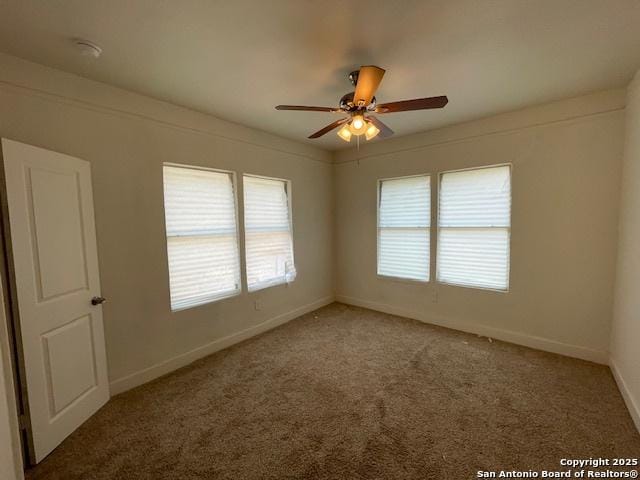 438 Vanderbilt, San Antonio, TX 78210 - spare room featuring healthy amount of natural light, carpet floors, a ceiling fan, and baseboards