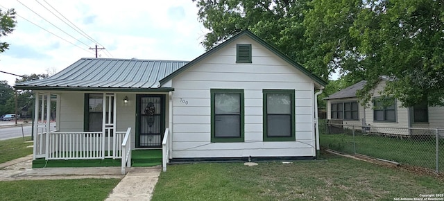 700 Clay St, Kerrville, TX 78028 - bungalow-style home with a porch and metal roof
