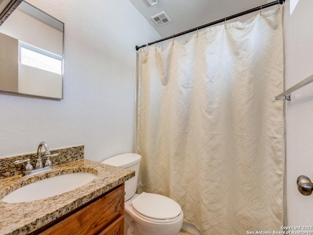 8227 Grand Bnd, San Antonio, TX 78250 - bathroom featuring toilet and vanity