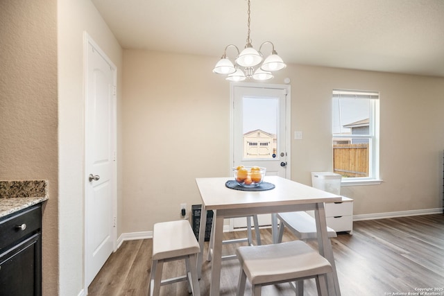 6516 Sabinal, San Antonio, TX 78252 - dining room with wood finished floors, a chandelier, and baseboards