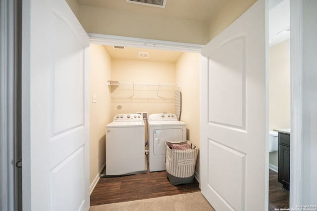 6516 Sabinal, San Antonio, TX 78252 - washroom featuring washer and dryer, dark wood finished floors, and baseboards