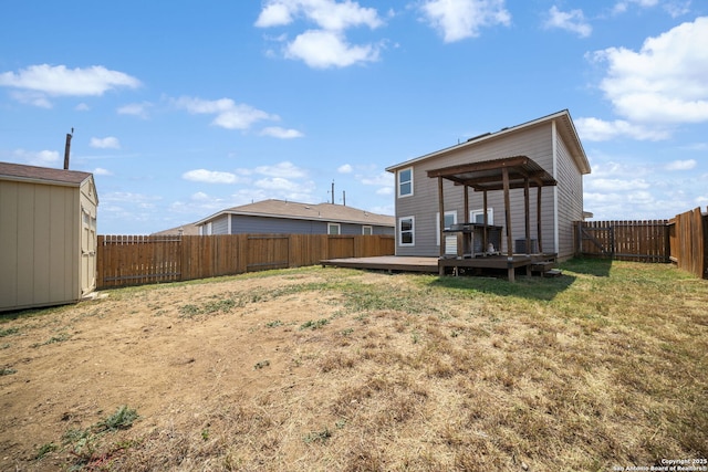 6516 Sabinal, San Antonio, TX 78252 - rear view of house with a wooden deck, a storage unit, and an outbuilding