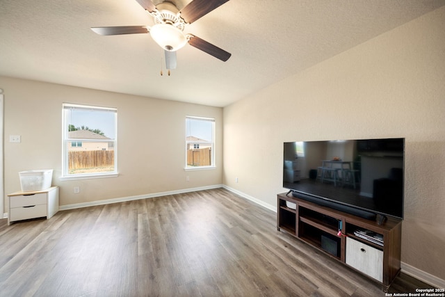 6516 Sabinal, San Antonio, TX 78252 - living area featuring wood finished floors, ceiling fan, and baseboards