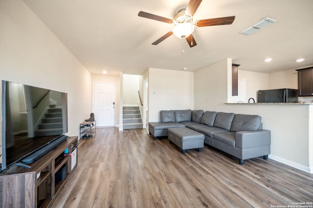 6516 Sabinal, San Antonio, TX 78252 - living area featuring stairs, a ceiling fan, light wood-style floors, recessed lighting, and baseboards
