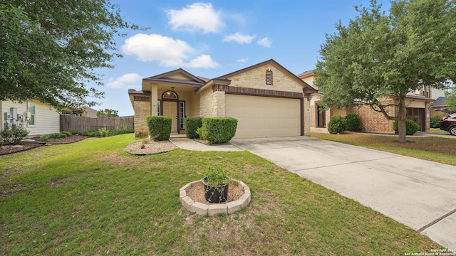 760 Guna, New Braunfels, TX 78130 - view of front of property featuring stone siding, an attached garage, and driveway