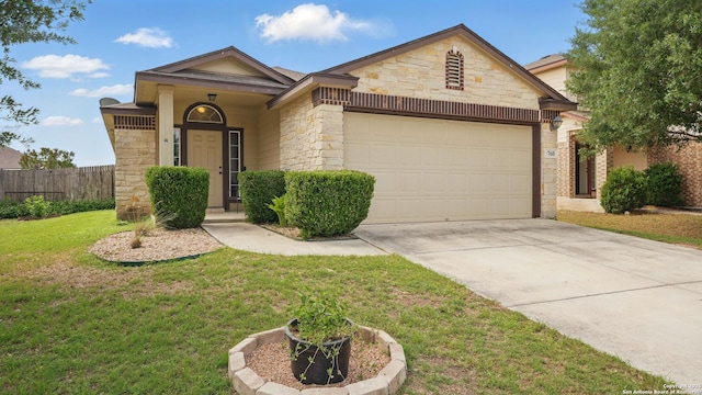 760 Guna, New Braunfels, TX 78130 - view of front of house with stone siding, an attached garage, and concrete driveway