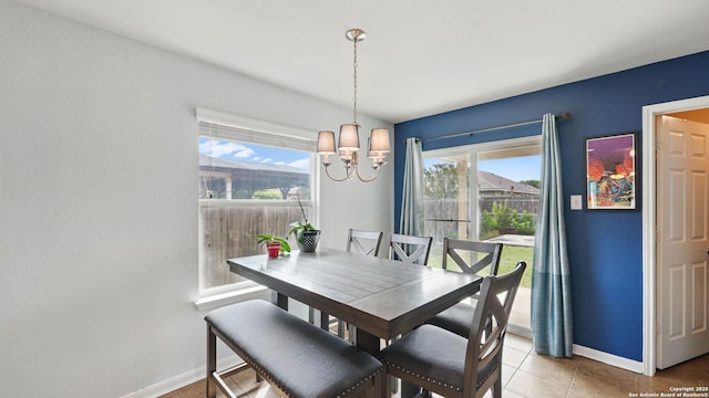760 Guna, New Braunfels, TX 78130 - tiled dining room with a chandelier, baseboards, and plenty of natural light