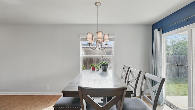 760 Guna, New Braunfels, TX 78130 - tiled dining area featuring a chandelier and baseboards
