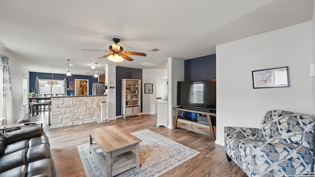 760 Guna, New Braunfels, TX 78130 - living room with ceiling fan, wood finished floors, and baseboards